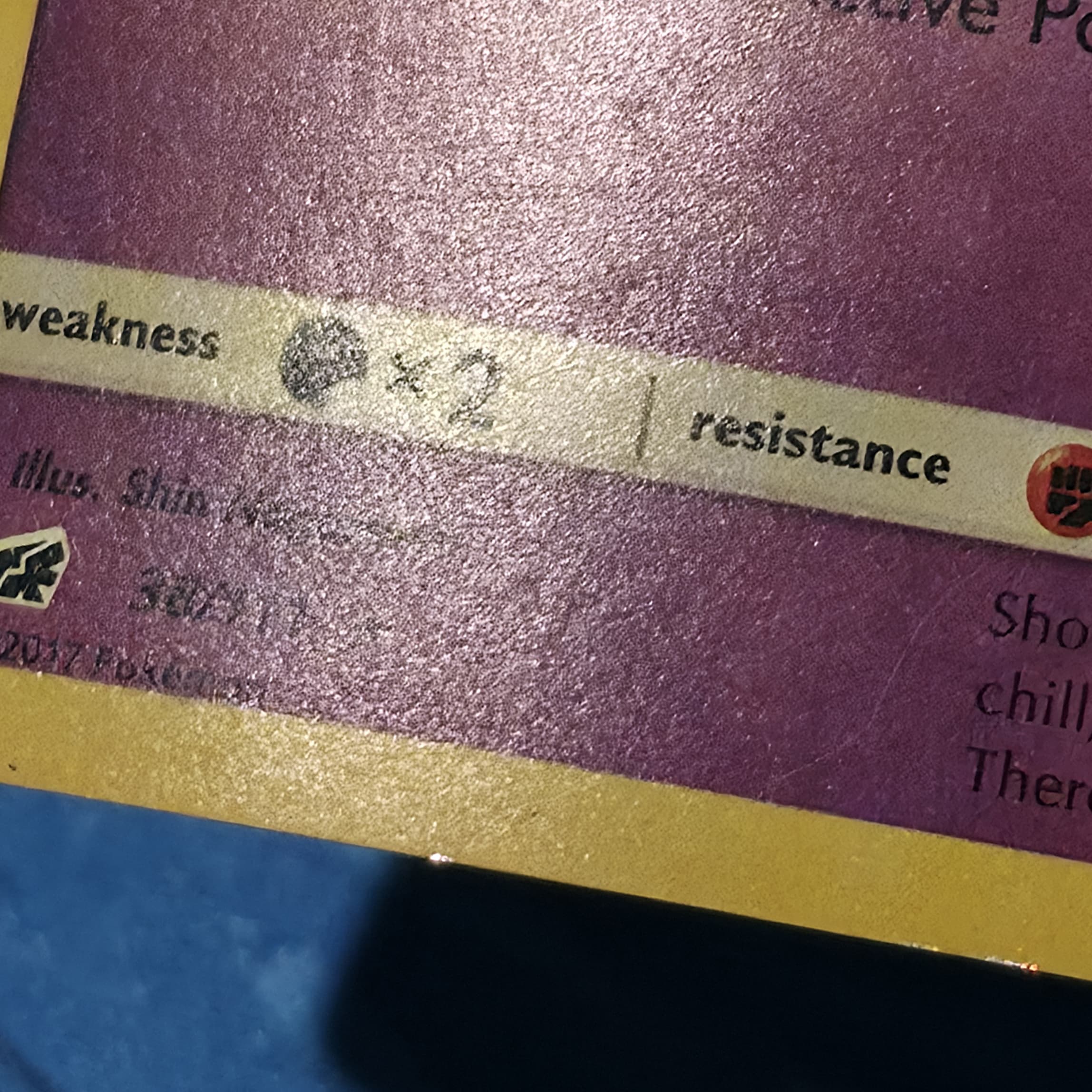 Gengar holographic Pokemon card after deep dent repair — dents reduced and cleaner holo presentation
