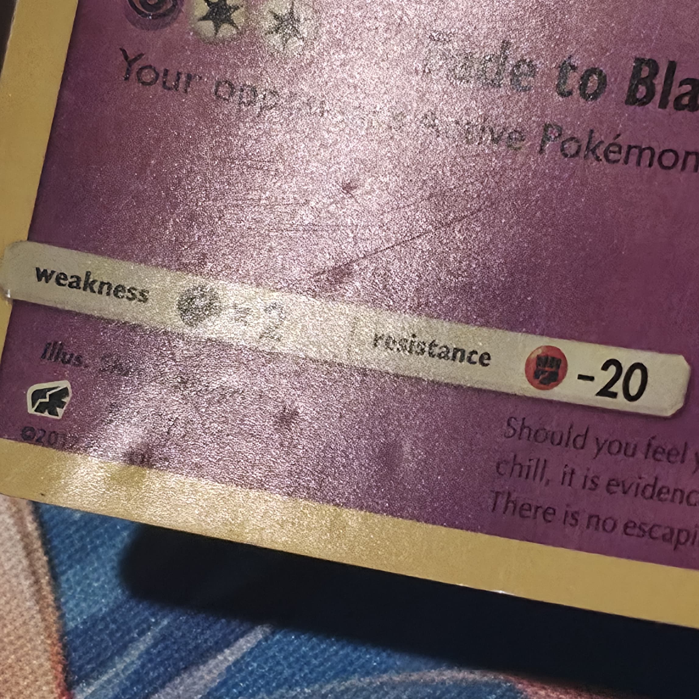 Gengar holographic Pokemon card before deep dent repair — circular dents and surface damage
