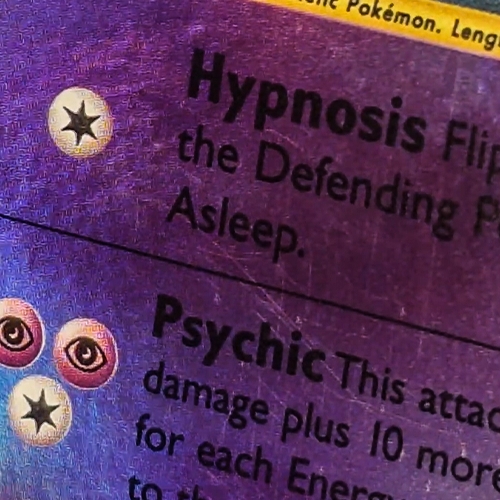 Mewtwo Pokemon card before scratch repair — scratches across the Hypnosis and Psychic text